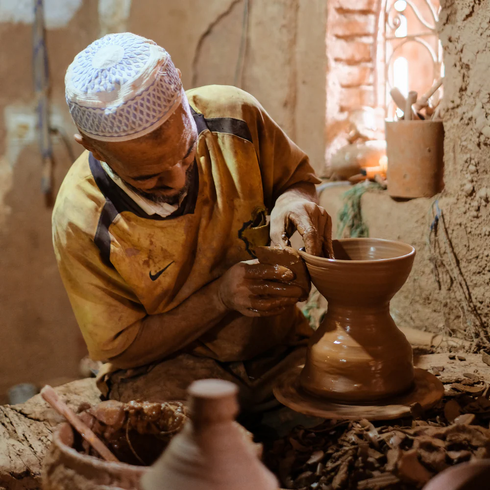 Moroccan Artisan working on a handmade product.