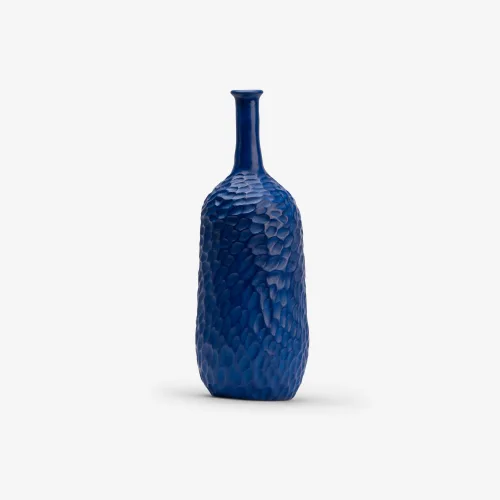 Bring depth and colour to your space with this textured blue ceramic vase. A handmade modern home decor accessory that blends form, colour, and artisanal detail.