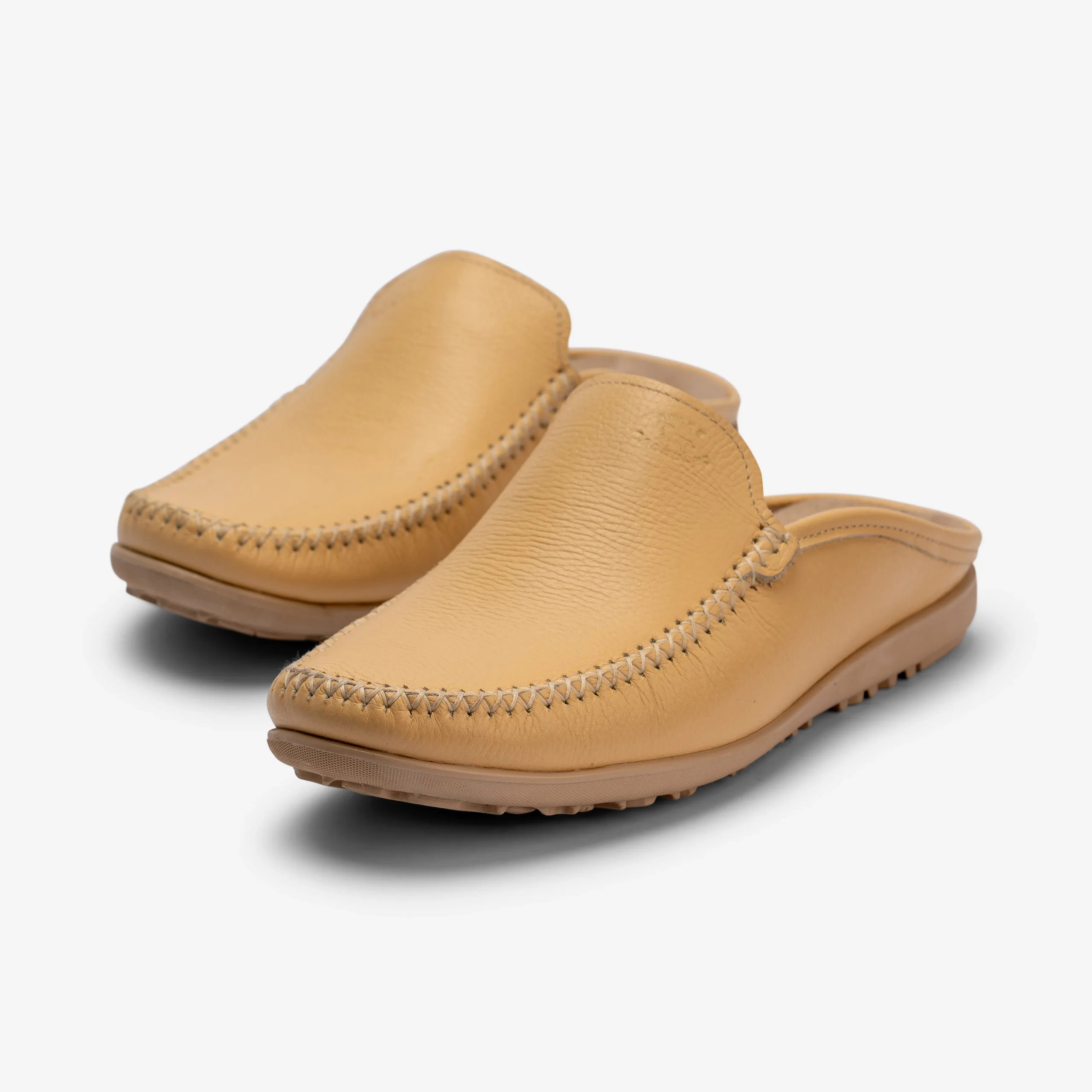 Step into timeless Moroccan craftsmanship with these handmade tan leather mule slippers. Stylish, lightweight, and perfect for everyday comfort.