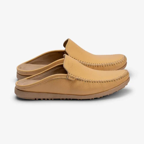Step into timeless Moroccan craftsmanship with these handmade tan leather mule slippers. Stylish, lightweight, and perfect for everyday comfort.