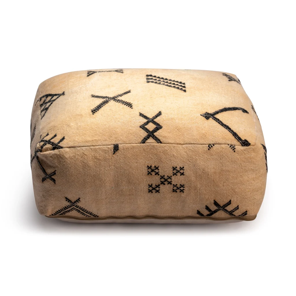 Shop our square Moroccan leather pouf ottoman, handmade from vintage rugs with traditional Berber motifs. A 16x16x12 wool and cotton pouf with hidden zipper—perfect as a floor cushion or footstool.