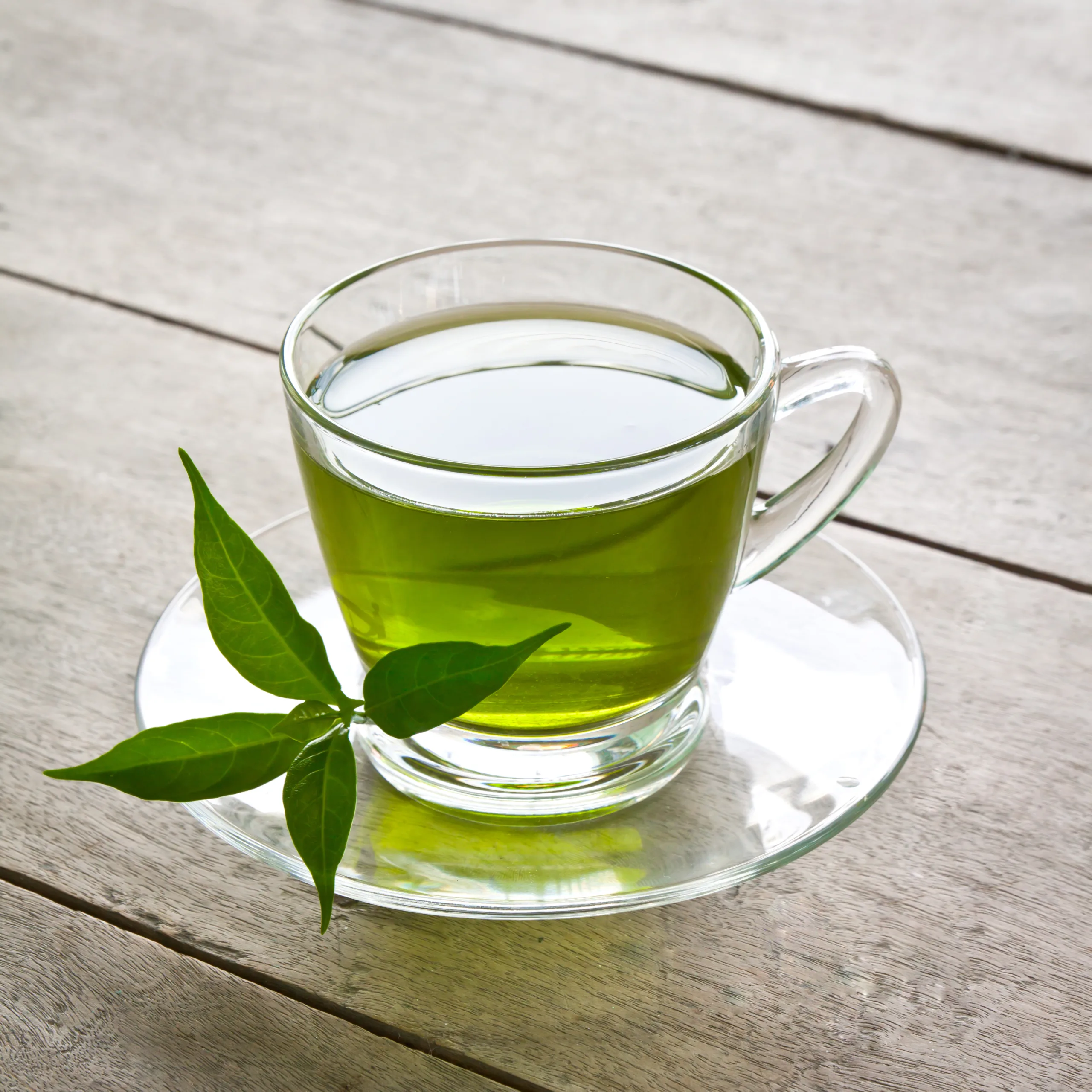 a cup of green tea on wood board, drink for health