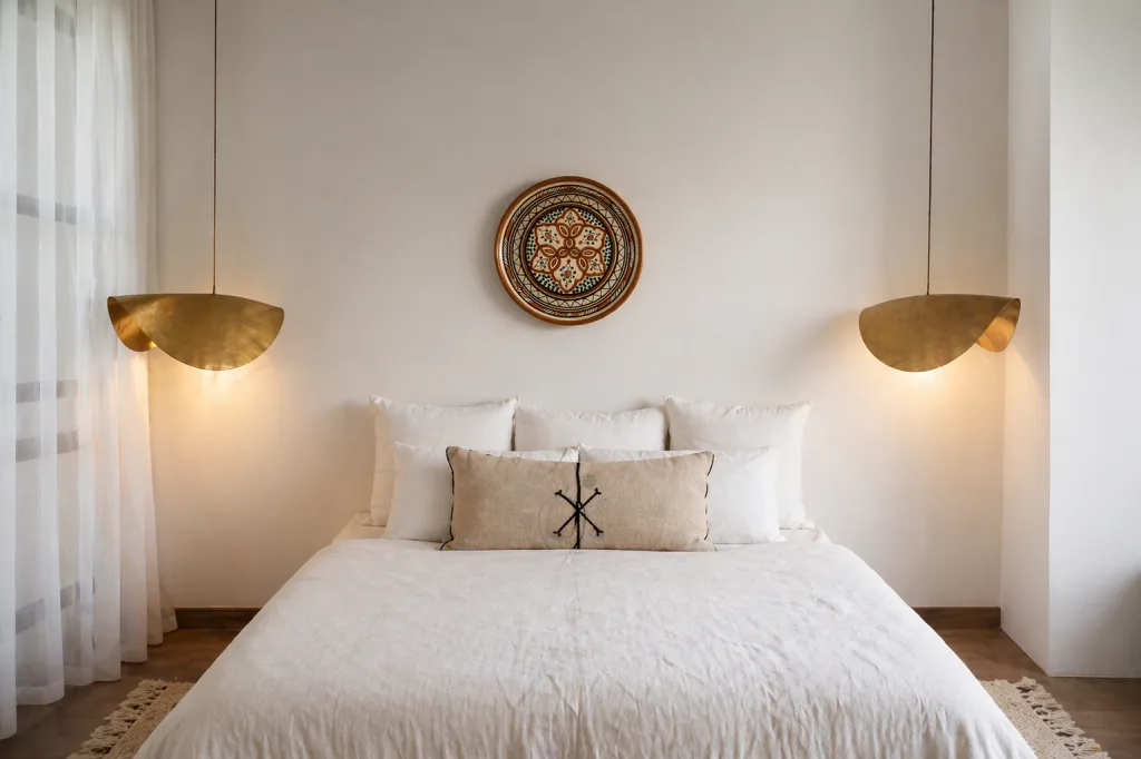 Bedroom with a decorative Moroccan plate and 2 Hanging Moroccan Lighting lamps